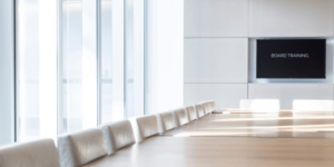 Board room with board training on screen